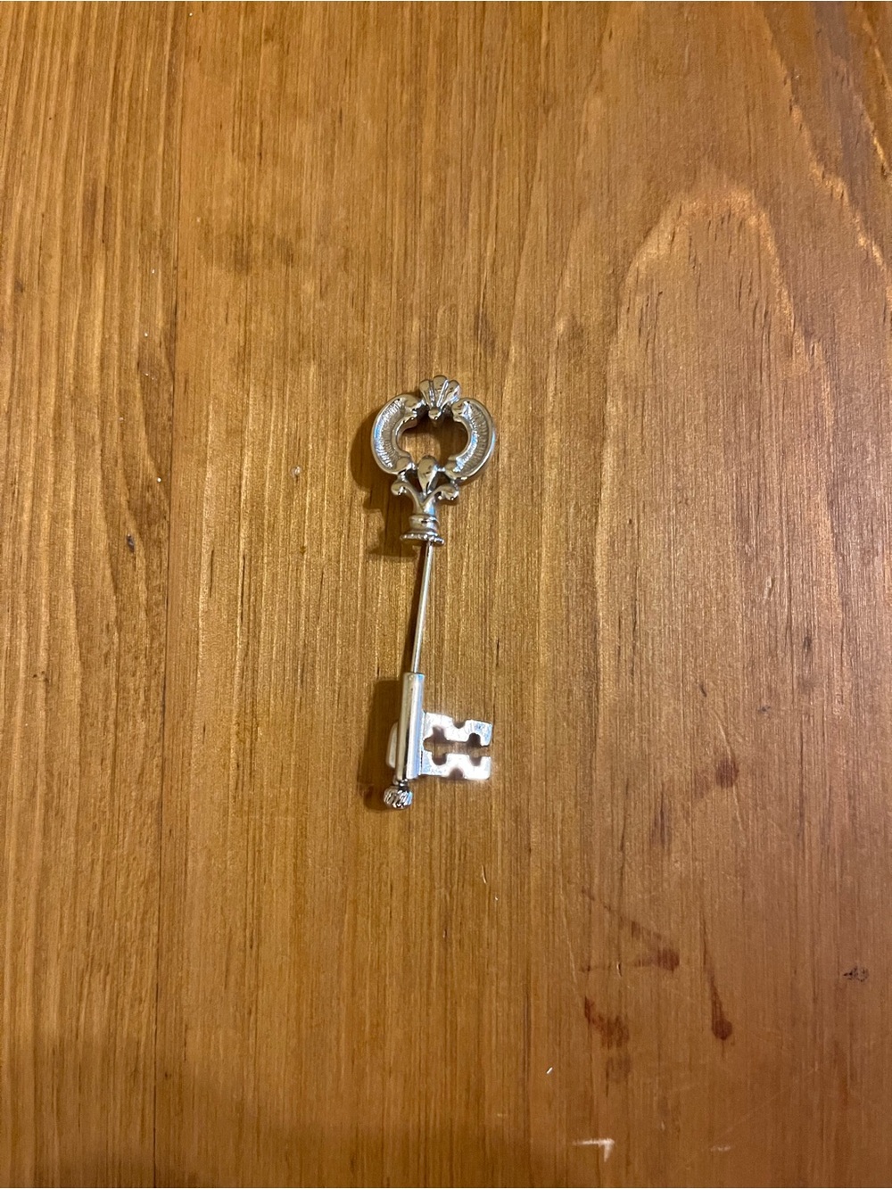 Vintage Avon marked skeleton key stick pin on silver tone 2”